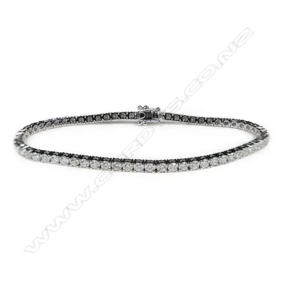 An 18ct white gold and diamond tennis bracelet,
