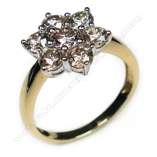 An estate 14ct gold and diamond cluster ring,