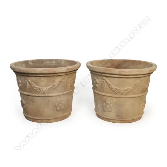 A pair of large terracotta classical garden urns,
