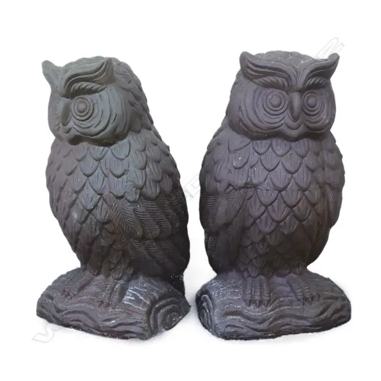 #A pair of stoneware sculpted owl garden ornaments