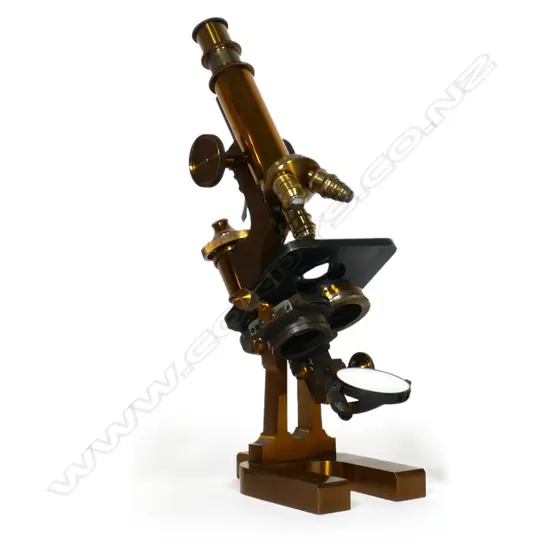 An Ed. Messter of Berlin lacquered brass compound microscope, rectangular horseshoe base, slotted pillar, tubular limb with triangular rod, topped by fine adjuster. Substage lens, iris diaphragm and double mirror. Body tube with double milled head pinion, triple objective lens swivel cluster. Signed and dated 1894 under the base. Provenance: ex The Jack Thornton estate collection.