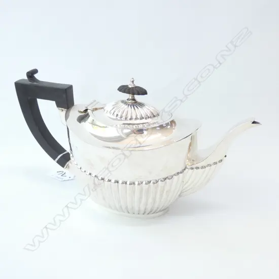 Silver teapot with half lobed body. Birmingham 1916 by William Aitken. 362gms.