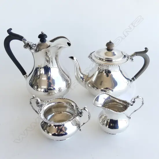 Four piece sterling silver tea set of baluster form. 933gms