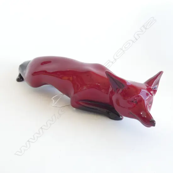 A large Royal Doulton flambe stalking fox, signed Noke (under the tail)