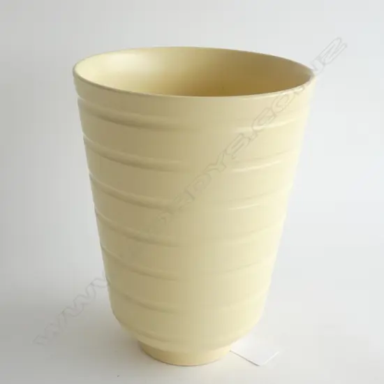 A Wedgwood Keith Murray vase. Straw matt coloured glaze,