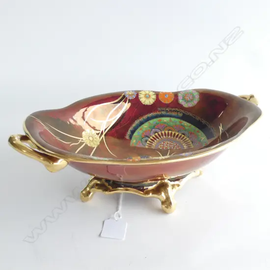 An Art Deco Carlton Ware enamelled bowl on four gilded feet