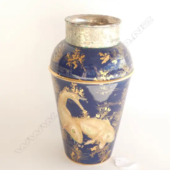 A Carlton ware cocktail shaker with silver plated collar