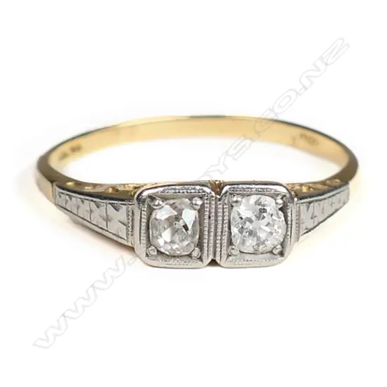 A vintage 18ct gold and two diamond ring,