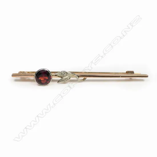 A 9ct gold garnet bar brooch,