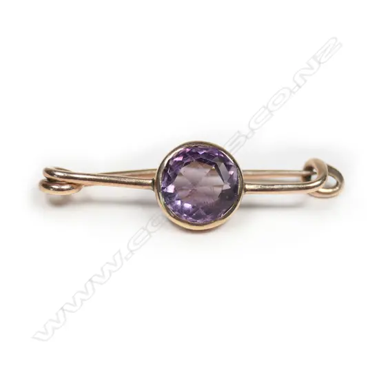 A 9ct gold, amethyst safety pin brooch,