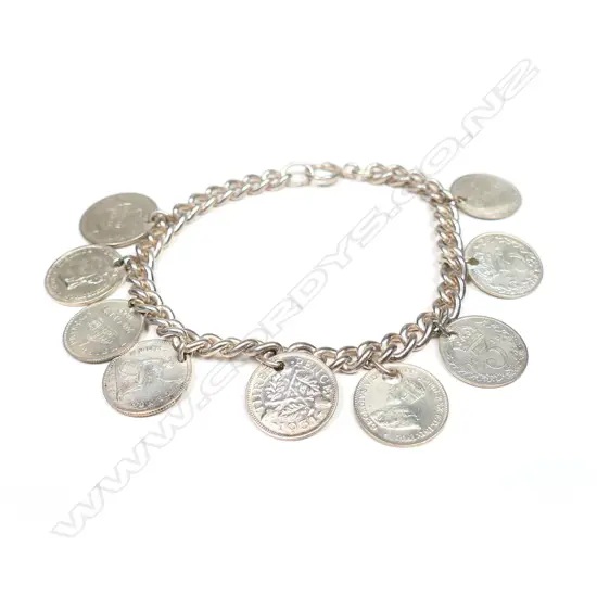 A vintage silver bracelet with silver coin charms,