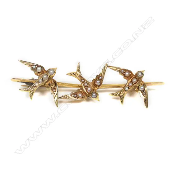 A late Victorian, 15ct yellow gold seed pearl three swallow brooch,