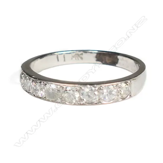 A 14ct white gold, diamond band ring,