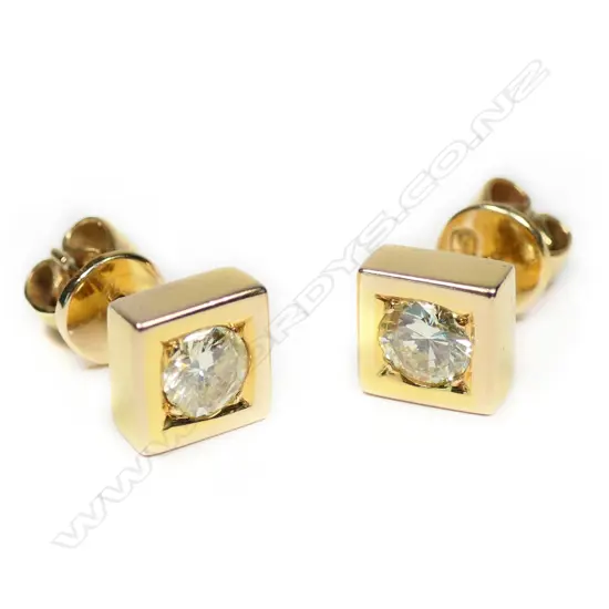 A pair of14ct yellow gold diamond set studs earrings,