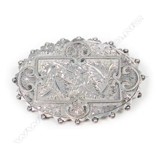 A Victorian sterling silver ornate brooch,