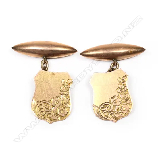 A pair of Edwardian 9ct gold shield engraved cuff links,