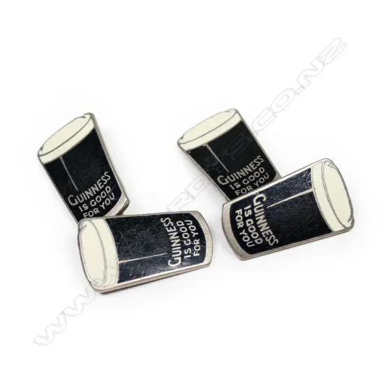 A pair of vintage nickel and enamel Guinness cufflinks,