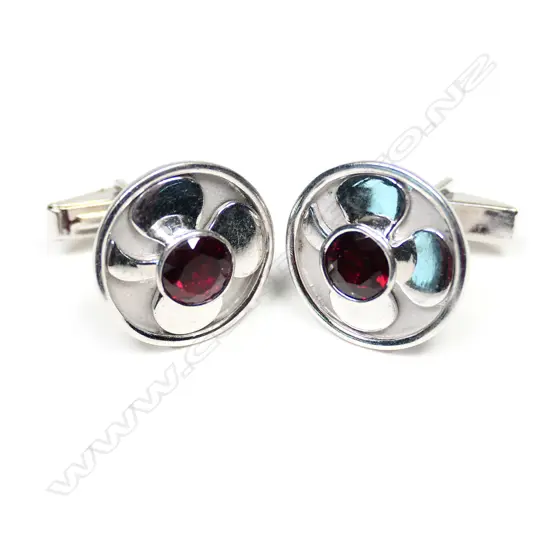A pair of vintage silver and garnet cuff links