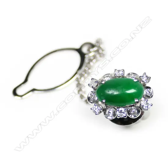 A modern 14ct white gold apple green jade and diamond cluster tie tack,