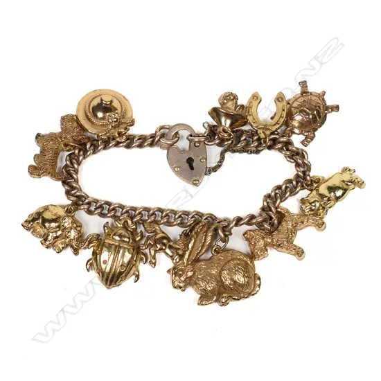 A vintage rolled gold French charm bracelet,