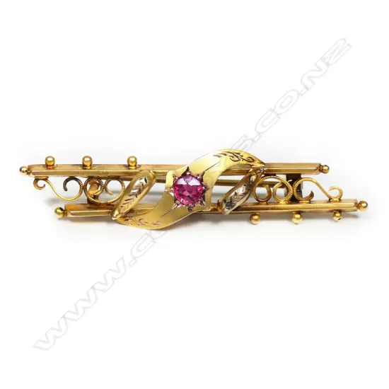 A Victorian gilded 9ct garnet topped doublet bar brooch,