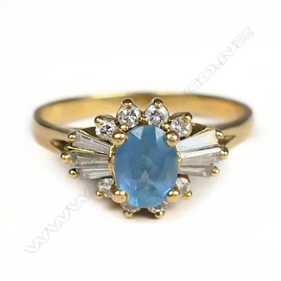 An 18ct yellow gold aquamarine and diamond cluster ring,