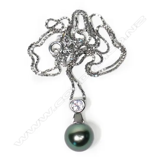 A modern sterling silver Tahitian pearl and cz pendant.