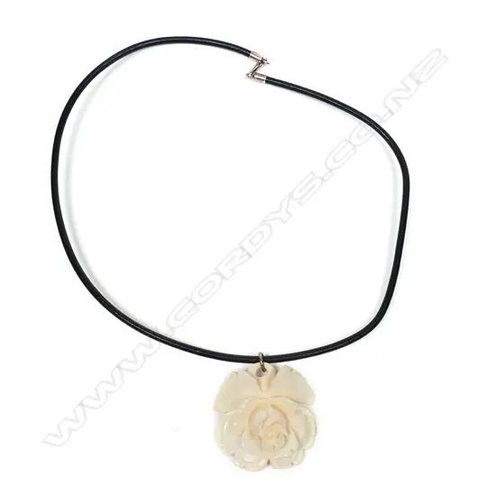 A vintage carved ivory rose pendant,