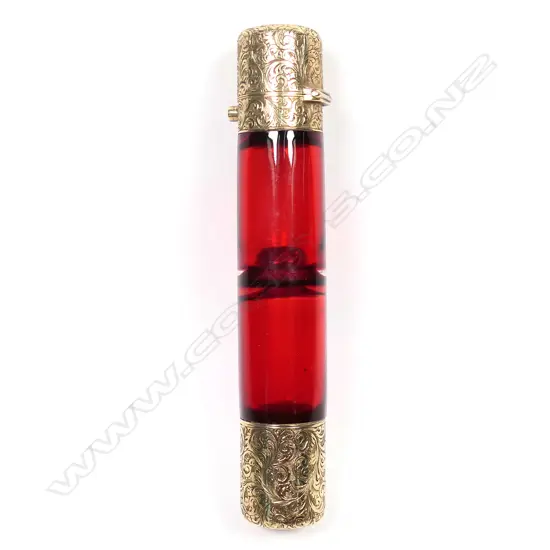 A Victorian rolled gold and cranberry glass double ended perfume bottle,
