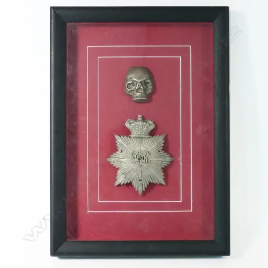 Framed British Victorian helmet plate & unrelated skull badge. 250 x 360mm