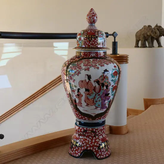 A large Japanese Imari lidded urn on stand