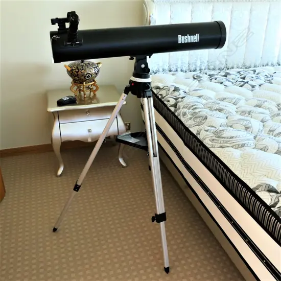 A 'Bushnell' large telescope on tripod
