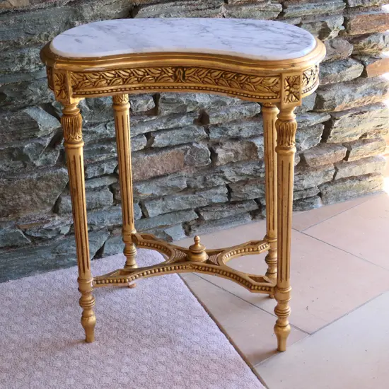 A marble topped gilt kidney form table