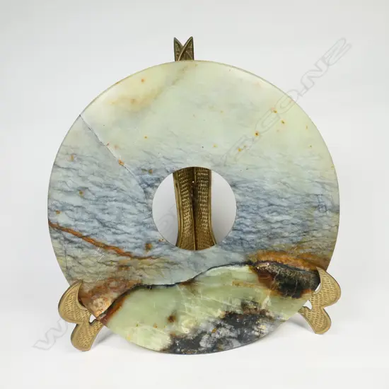 A large agate carved pi disc,