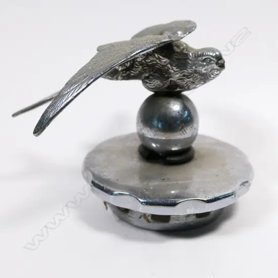 Early 20thC chrome swallow (bird) on ball car mascot,
