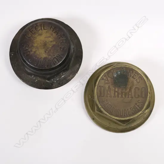 two early named 20thC vintage bronze/brass car hubcap nuts,