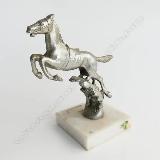 Chromed rearing horse car mascot, on marble base,