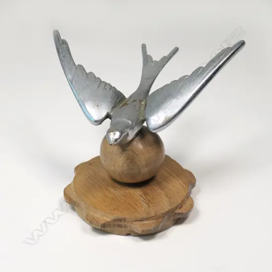 Chrome swallow(?) car mascot,