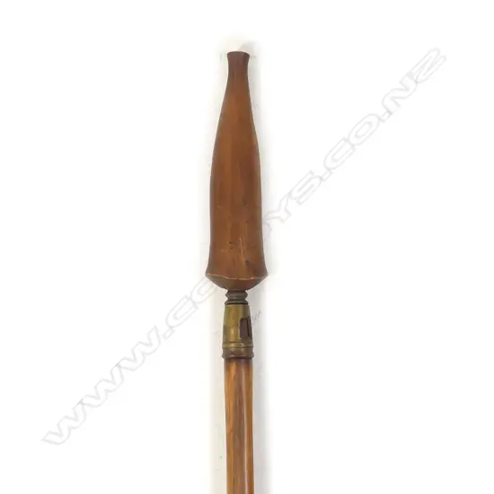 A steel spear head, of unknown origin, with brass socket fitting to a hardwood shaft;