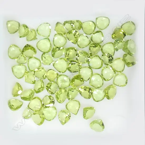 63 PERIDOT, 13.77cts. RATING 5-6