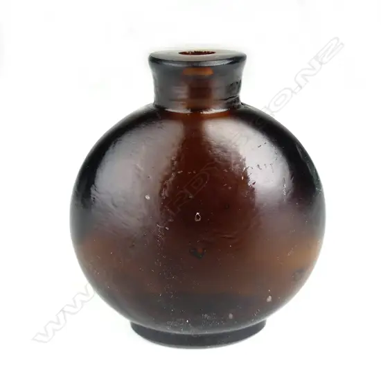 A Chinese dark amber coloured glass snuff bottle