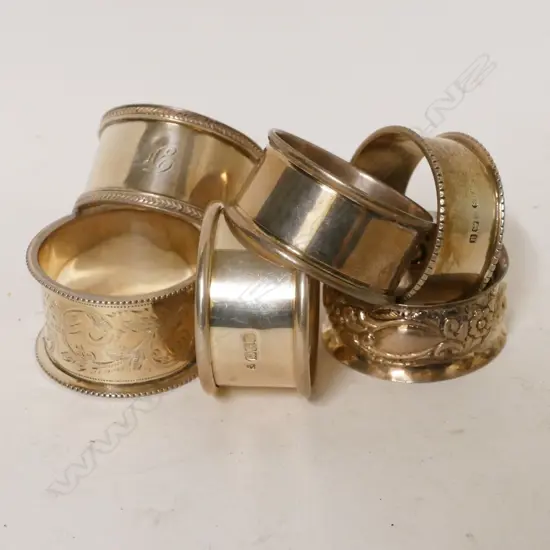 Six various silver napkin rings