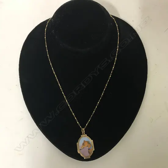 A  Victorian gold and enamel dog pendant