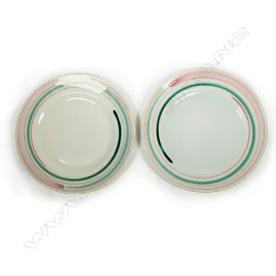 Pair Frank Carpay plates for Crown Lynn; green and pink swirl decoration to rim. Dia.230mm