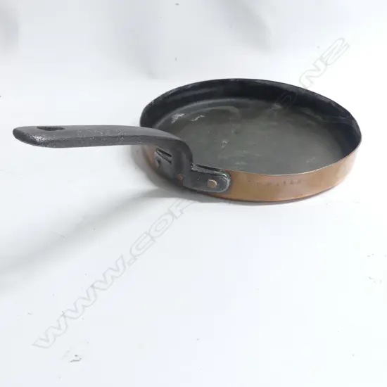 A 19thC copper frying pan with iron handle. Dia.285mm. Stamped to the rim 'The Albion'