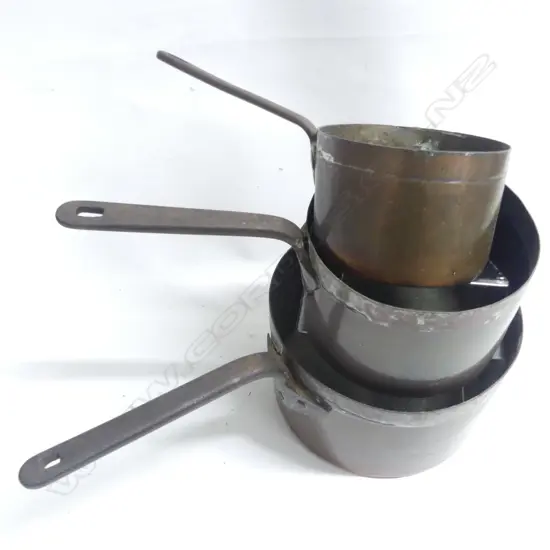 A graduated set of three antique copper saucepans the long iron handles with copper rivets. Dia.140. 175 and 230mm.
