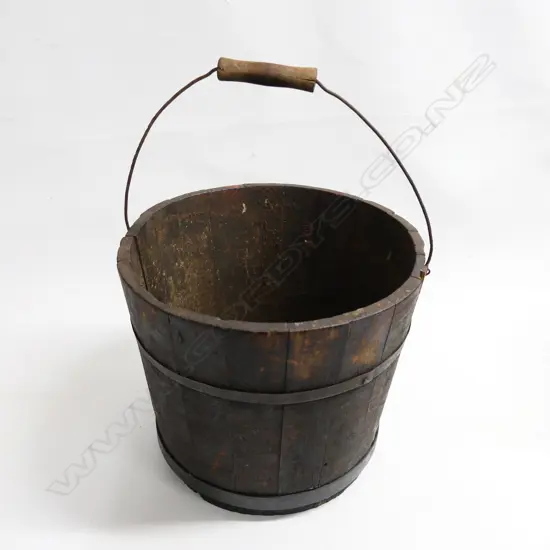 An old coopered wooden pail, with metal binding, swing handle. Dia.310mm