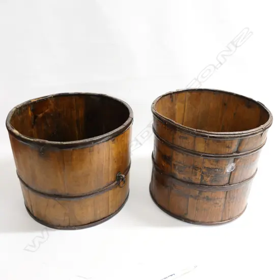 A pair of old wooden buckets, three metal rings to each bucket, one with carrying ring. Dia.302 and 340mm