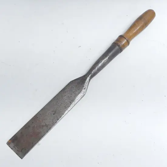 A 19thC J.Beaty 2½" hand forged large mortise chisel, makers name to blade. Turned oak handle to the socket fitting. L.640mm