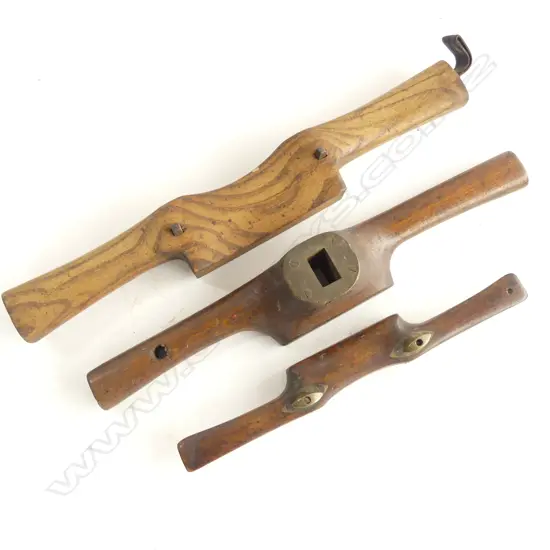 Three old wooden hand tools; oak spoke shave, beech spoke shave with brass fittings, and an oak handled router with steel sole and brass top plate fitting